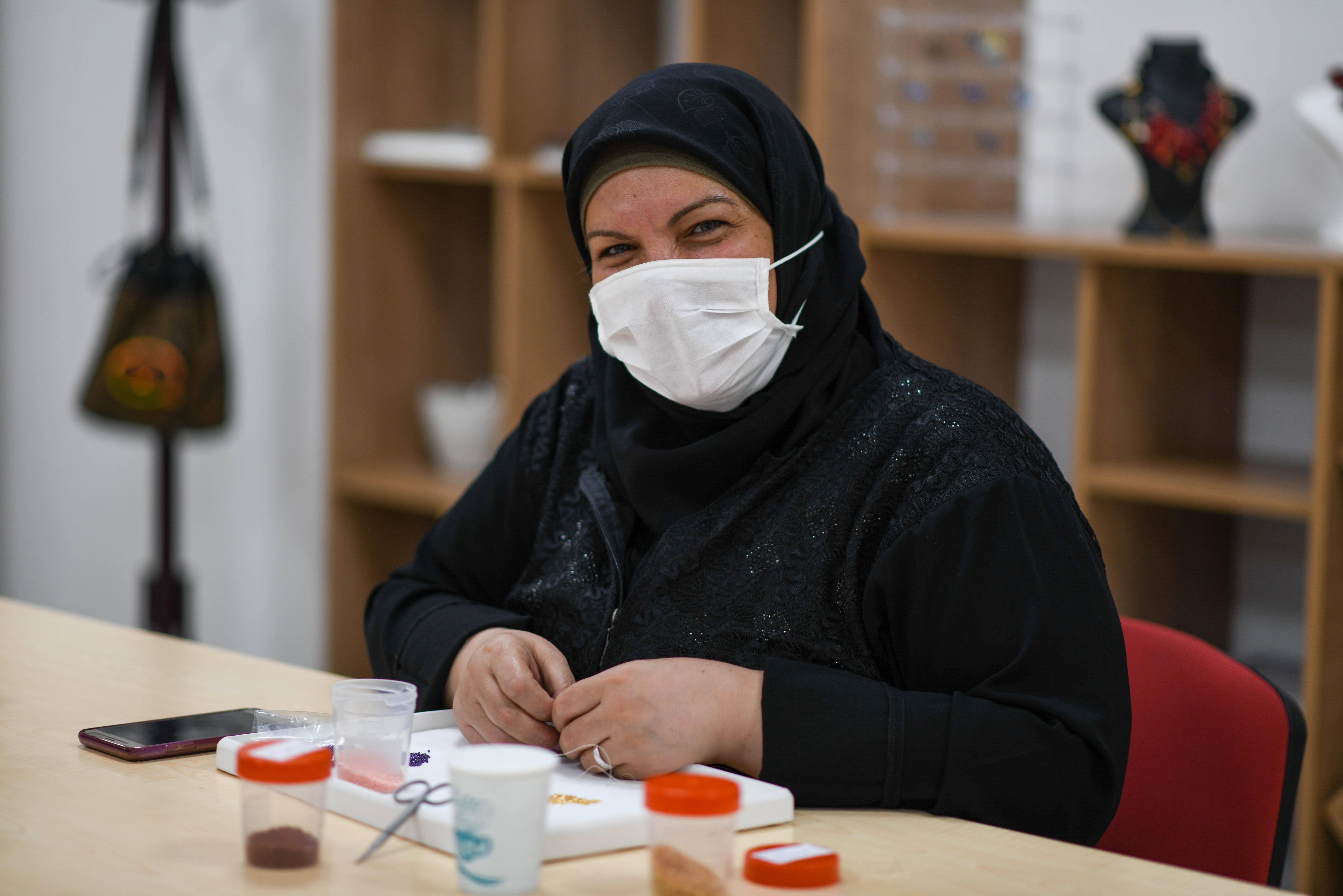 Turkish and Syrian women are attending a jewellery design course at a Community Center run by Turkish Red Crescent in partnership with IFRC in Ankara's Altindag district on August 19, 2020. Community centres, located in 15 cities across Turkey, increase livelihoods, resilience and self-reliance, provide community-based health and first aid, give psychosocial support to both refugees and host community.