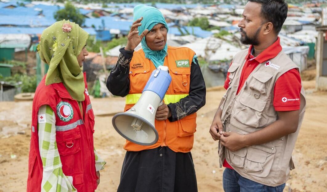 Red Cross volunteers train migrants in Bangladesh on first aid, early warning systems, and other skills so they can respond to flooding, cyclones, and other hazards.