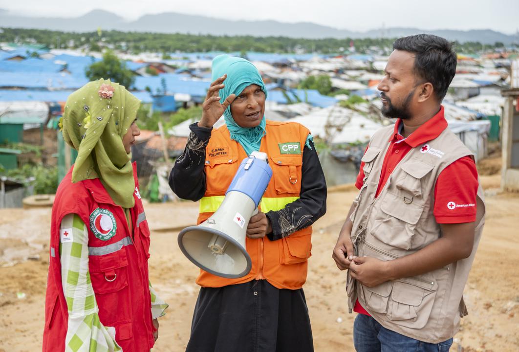 Red Cross volunteers train migrants in Bangladesh on first aid, early warning systems, and other skills so they can respond to flooding, cyclones, and other hazards.