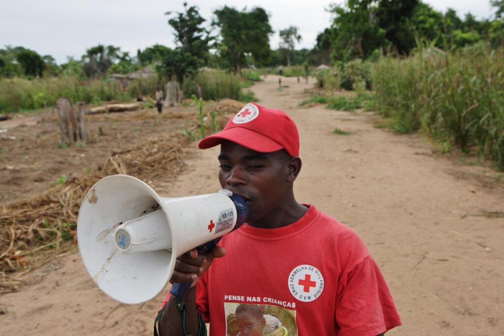 A Mozambique Red Cross taking part in an early warning drill in 24 de Julio, a small community outside of Mopeia. 