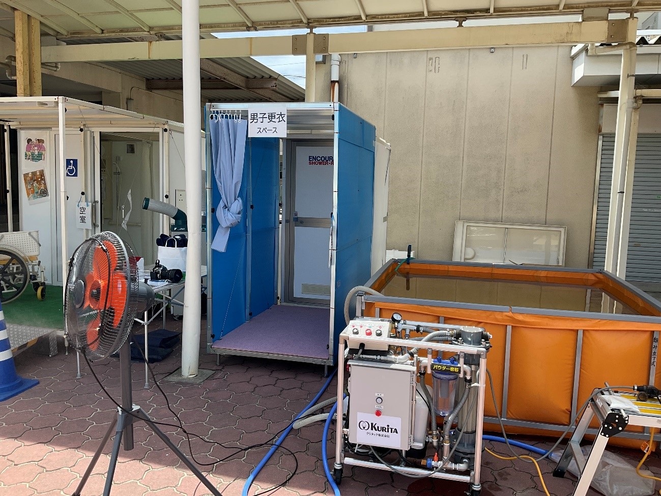 Demonstration of the shower system developed for the Japanese Red Cross Health Emergency Response Unit