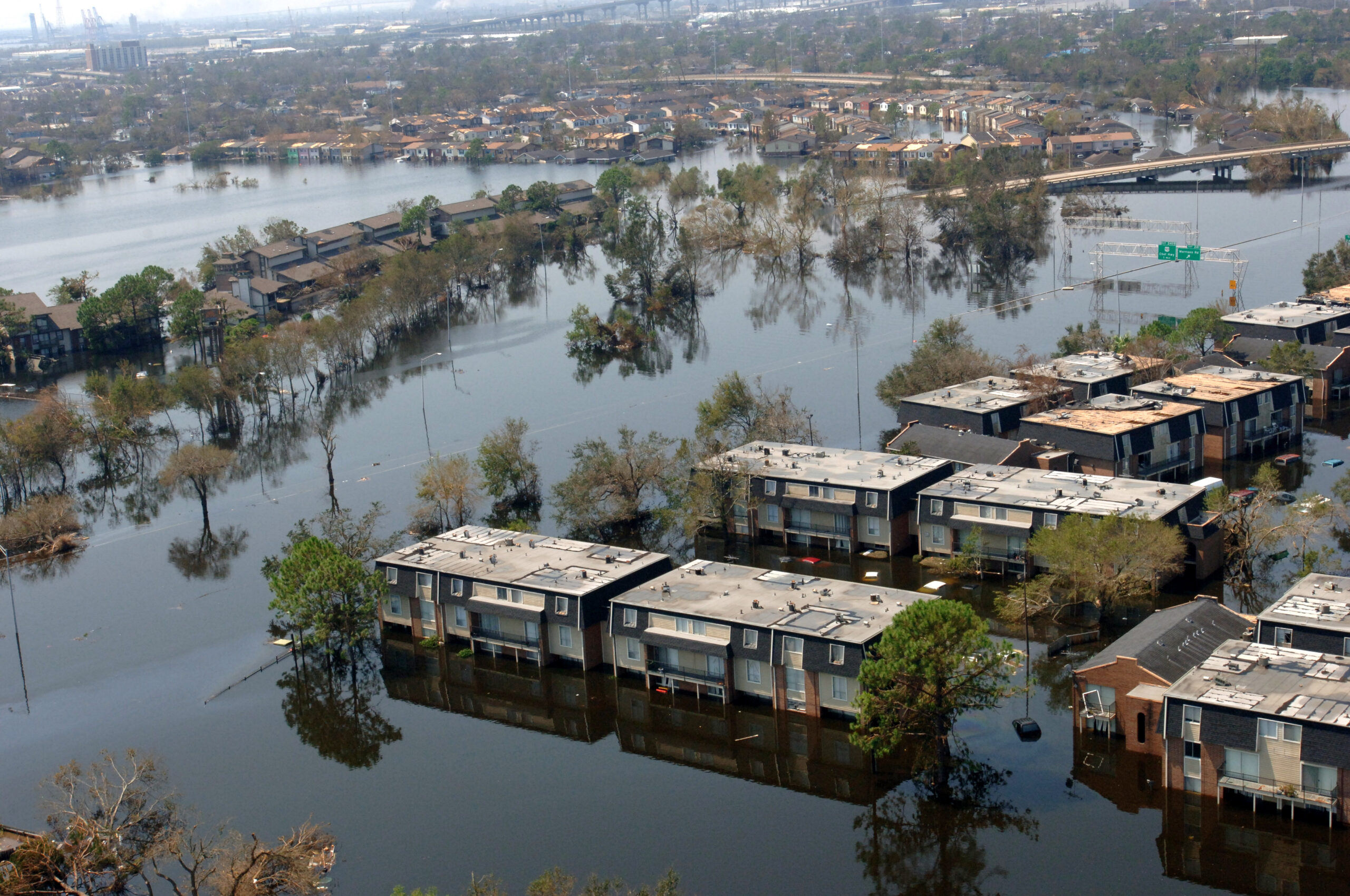 311-MAD-19088 Aerial view of flooded apartment buildings and submerged streets in New Orleans, Louisiana, following Hurricane Katrina in 2005.