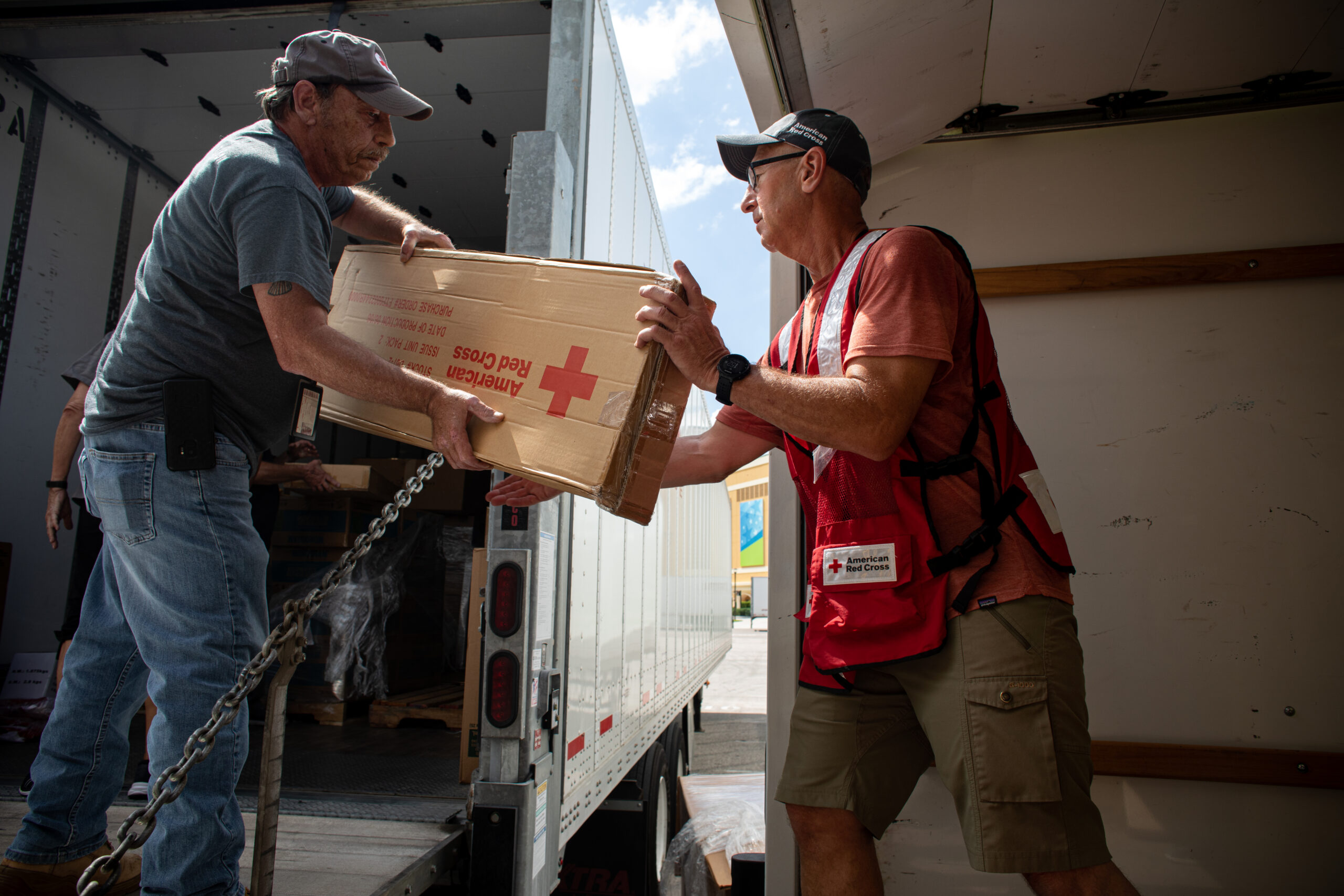 Hurricane Ian 2022 September 26, 2022. Orlando, Florida
Red Cross Fulfillment Team volunteers working ahead of Hurricane Ian, unload tractor trailers of supplies at the ESPN Center in Orlando, Fl. The goods will be heading to evacuation shelters all across Central Florida. The supplies include cots, blankets, gloves, flashlights and clean-up kits.