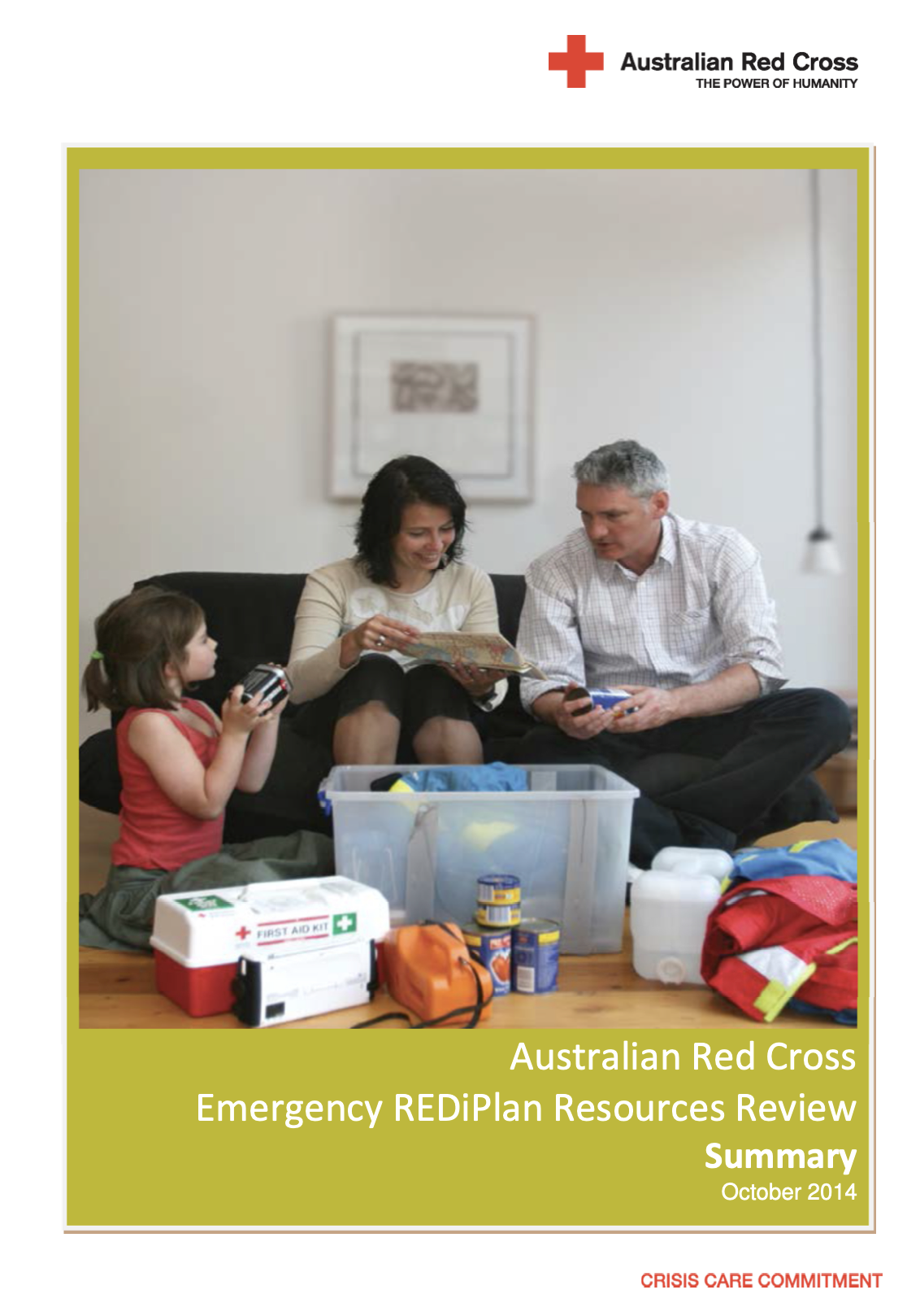 Australian Red Cross report cover titled 'Emergency REDiPlan Resources Review Summary, October 2014.' The photo shows a family on a couch reviewing an emergency preparedness plan together, with a child holding a torch beside a first aid kit and emergency supplies including a storage bin, canned goods, water containers, and a high-visibility jacket on the floor.