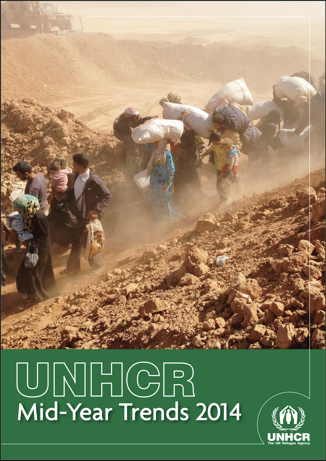 UNHCR report cover titled 'Mid-Year Trends 2014.' The photo shows a line of people, including families with children, walking up a dusty, rocky slope while carrying large bundles and bags of belongings, with a military vehicle visible in the hazy background.