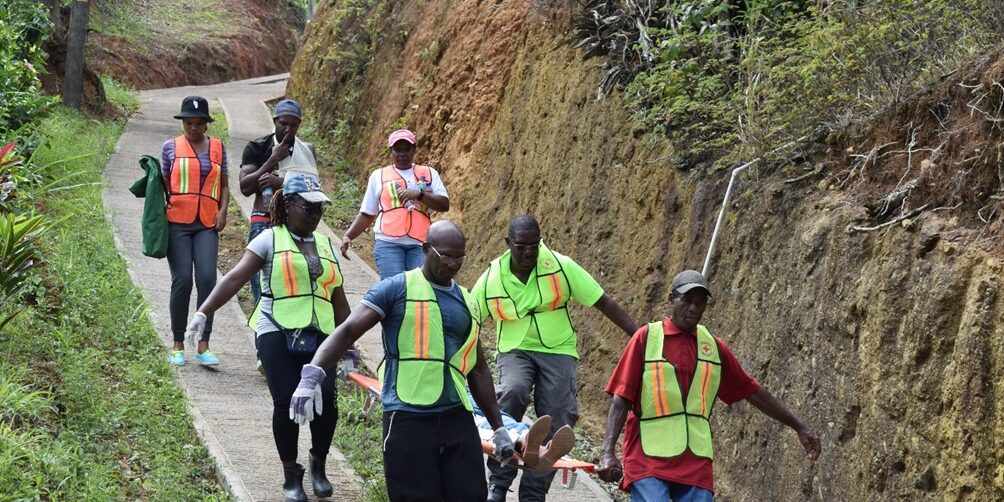 The Dominica Red Cross trains and helps form Community Disaster Response Teams to enhance resilience, promote disaster risk reduction, and strengthen early warning initiatives within communities.