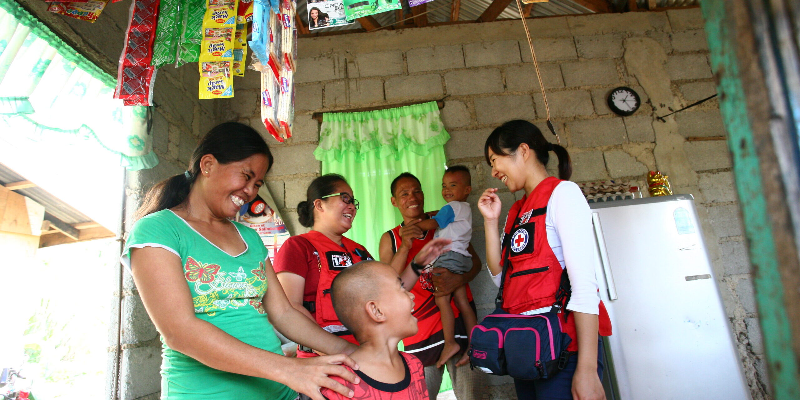 Beneficiaries of livelihood assistance happy with their refurbished store. 2015, Philippines. 